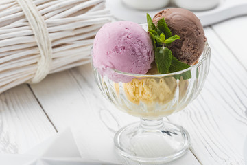 Balls of ice cream in a white glass