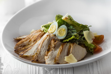 Chicken salad with eggs, lettuce and tomatoes