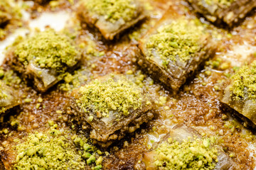 Detail of a tray full of delicious and sweet Turkish baklava dessert.