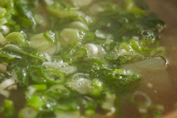 Spring onions in Korean beef soup