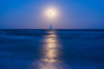 Night landscape with yacht on sea