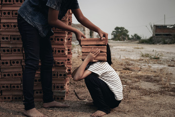 Child labor in building commercial building structures. World Labor Day concept