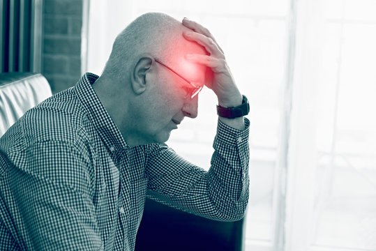 Older Man Has A Headache