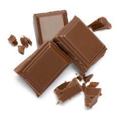 Milk organic chocolate pieces isolated on white background