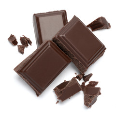 Dark organic chocolate pieces isolated on white background