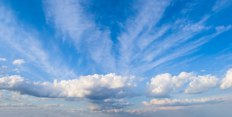 blue sky with dense cumulus clouds