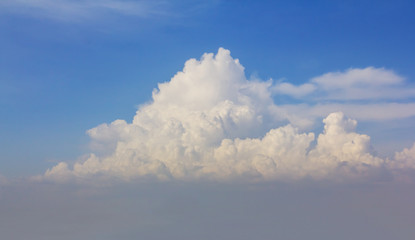 closeup huge cumulus cloud on a blue sky