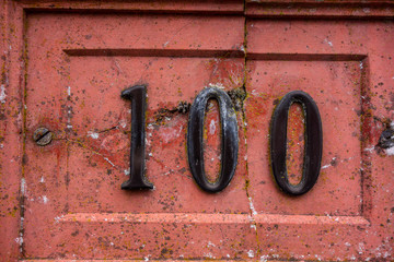 Written Wording in Distressed State Typography Found Number 100