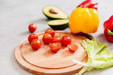 Fresh salad of avocado tomatoes, yellow and red peppers. Vegetarian lunch concept