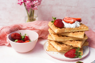 Waffles with strawberries and whipped cream