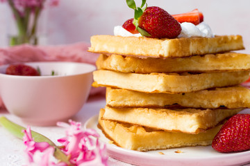 Homemade belgian Waffle. Strawberies and whiped cream.