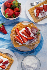 Homemade belgian Waffle. Strawberies and whiped cream.