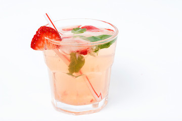 Cold summer drink with ice and strawberries on a white background