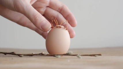 Easter DIY egg, made in bunny style. Minimal Easter concept, idea with rabbit. Craft hipster holiday. - Powered by Adobe