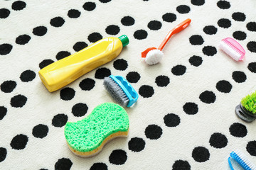 Cleaning supplies on soft carpet