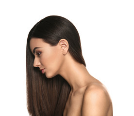 Fototapeta premium Portrait of beautiful young woman with healthy long hair on white background