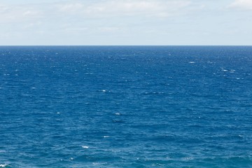 blue Atlantic Ocean background at sunny day