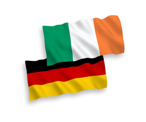 National Vector Fabric Wave Flags of Germany and Ireland Isolated on White Background. 1 to 2 proportion.