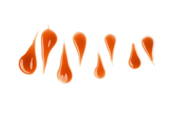 Liquid caramel on white background