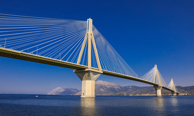 Fototapeta na wymiar The Rio Antirrio Bridge or Charilaos Trikoupis Bridge, photo taken from the boat during summer holidays 2018.
