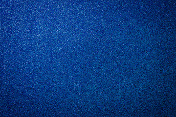 Metallic glitter blue background, close up. Dark gray paper backround. Blue glitter background from...