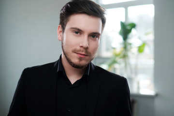 Confident young man attending job interview