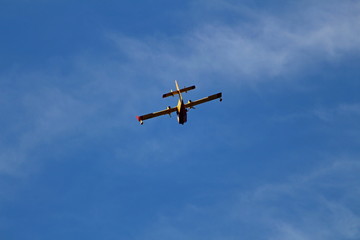 Fototapeta na wymiar a canadair fire brigade plane seen from behind