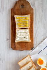 Cooking egg sandwich step-by-step for breakfast, top view. Flat lay, overhead, from above.