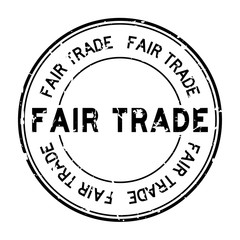 Grunge black fair trade word round rubber seal stamp on white background