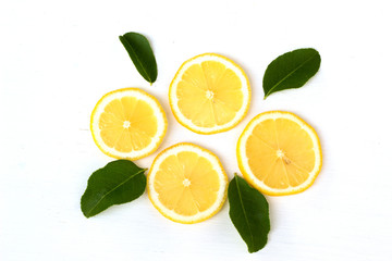 Fototapeta na wymiar fresh lemon and green leave fruit flat lay food concept isolate on white background