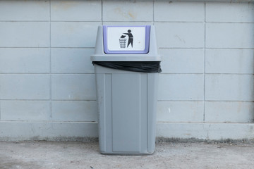 A bin in front the wall