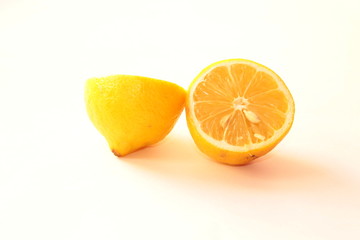 Two halves of lemon on white