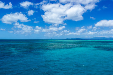 beautiful great barrier reef with white clouds on a sunny day, cairns, australia