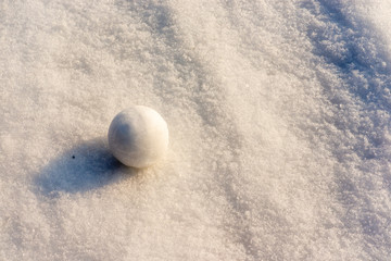 round snow lies on the snow