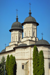 Fototapeta na wymiar Monastery Cetatuia, Iasi. Romania. Element of architecture. Building on the blue sky background.