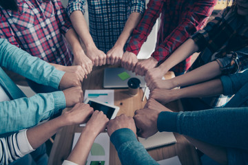 Cropped top above high angle view photo of professionals partners partnership place fists circle...