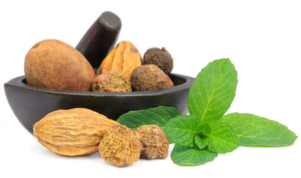 Triphala-a combination of ayurvedic fruits with mint leaves