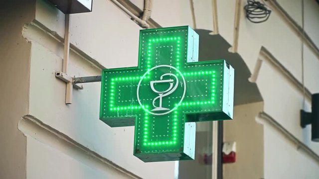 Iluminated Green Pharmaceutical Cross