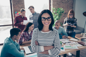 Portrait of nice stylish attractive intelligent cheerful lady experienced shark executive manager in casual eyewear eyeglasses crossed hands at industrial loft interior workplace workstation