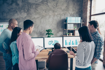 Rear back behind view of nice stylish busy smart clever intelligent managers experts wearing casual analyzing financial finance data research at industrial loft interior work place station