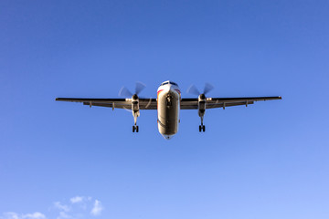 Montréal–Pierre Elliott Trudeau International Airport, Quebec, Canada, June 9, 2018: Flying aircraft preparing to land