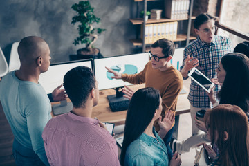 Fototapeta premium Above high angle view of nice smart clever nerd serious director ceo boss chief professional analyst wearing casual making data research at industrial loft interior workplace workstation