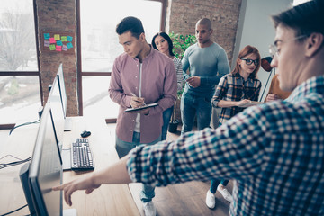 Close up photo mixed race business people noticing diary organizer planner discuss class lesson look screen talk finance secret genius development strategy investment  formal wear specs sweater shirt