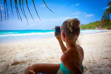Summer vacation travel tourism holiday photo - beautiful young blonde girl lying resting relaxing...