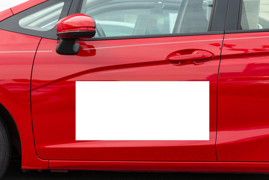 Blank White Megnetic Sign On Side Of Red Car