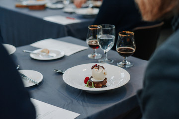 Table setting at the restaurant with beer and desert