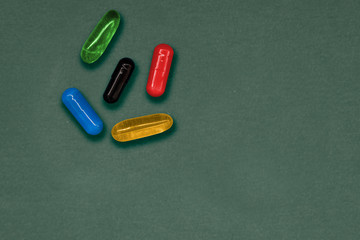 Make a choice. Problem of choice. There are not only red and blue pills. Set of five colorful capsules to illustrate that choice is much complicated that we thing