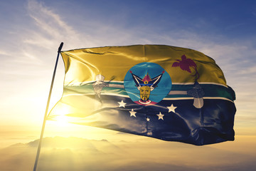 Hela province of Papua New Guinea flag waving on the top sunrise mist fog