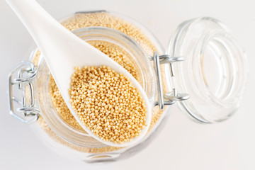 amaranth beans in spoon and glass bowl