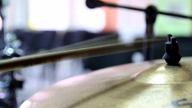 Rhythm is played on a ride plate. Close-up